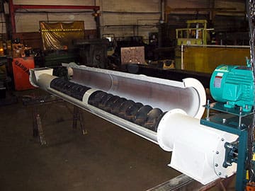 Screw Conveyors in white housing with green motor