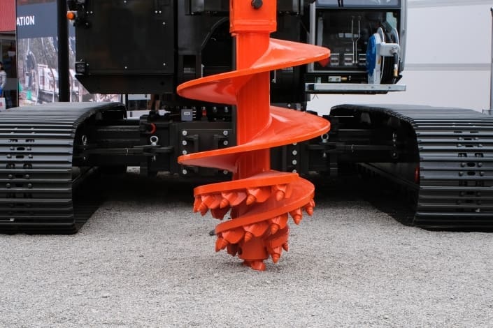 Brand new red Auger attached to a machine